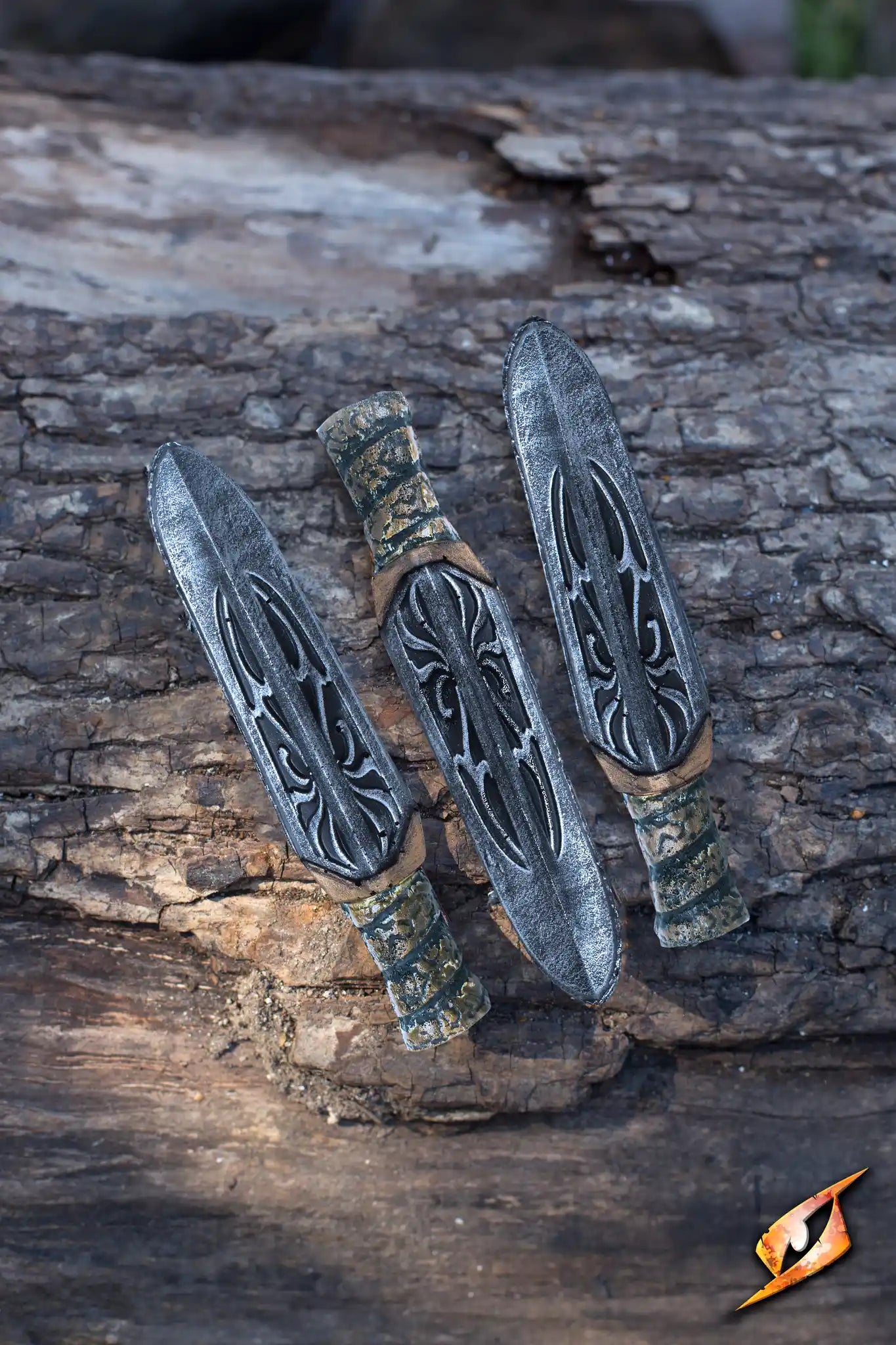 Assassin Rebel Knives - 13 cm - 3 pcs laid on a wooden surface showcasing their intricate designs.