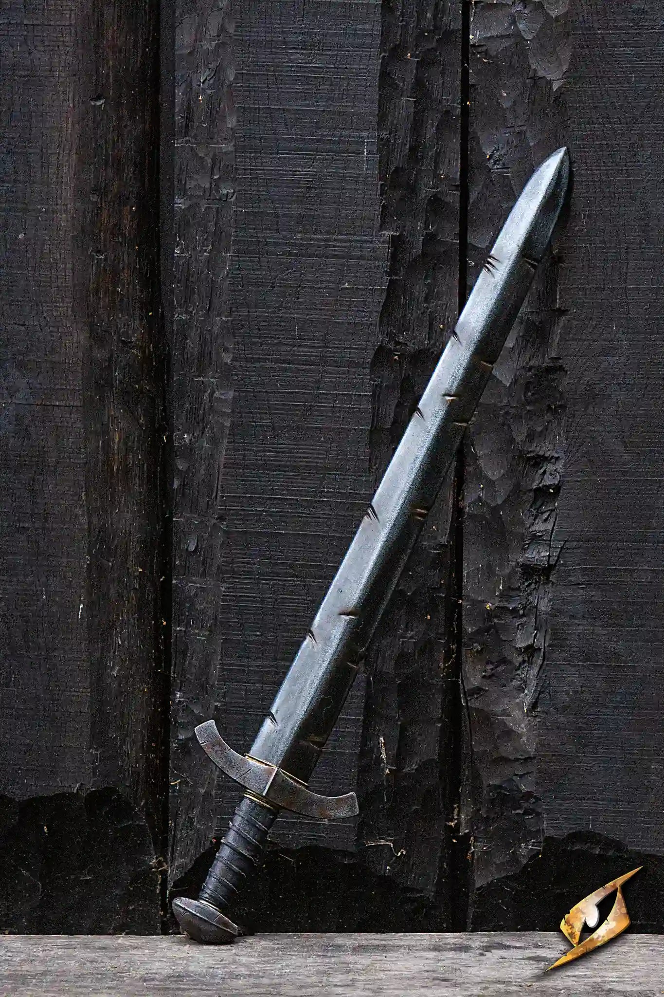 Battleworn Squire Sword resting against a dark wooden background, featuring a double-edged blade and detailed grip.