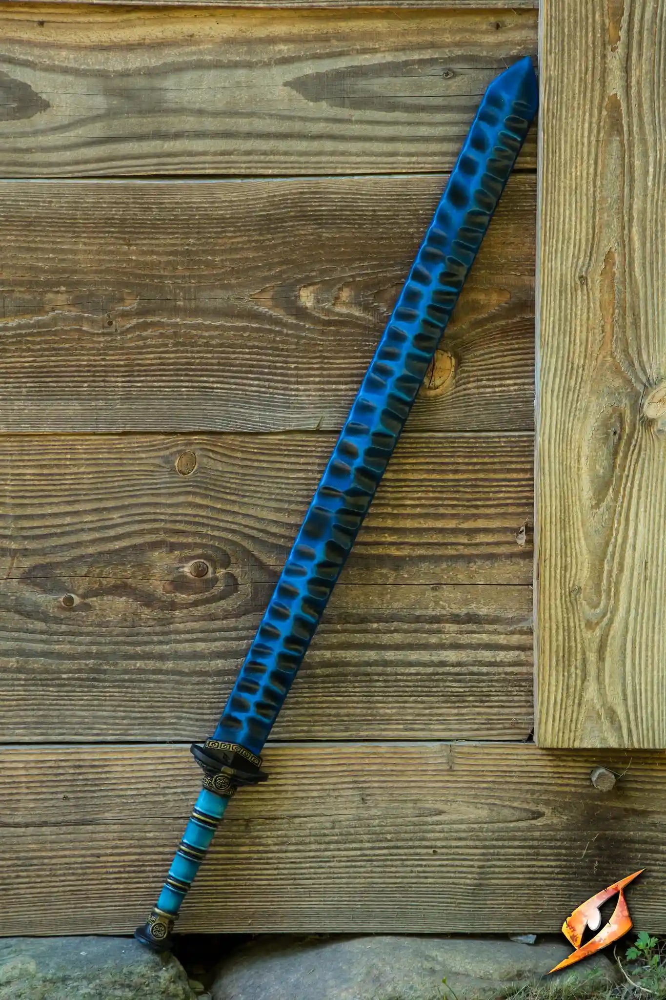 Magic Jian displayed against a rustic wooden backdrop, showcasing its vibrant blue design and intricate details.