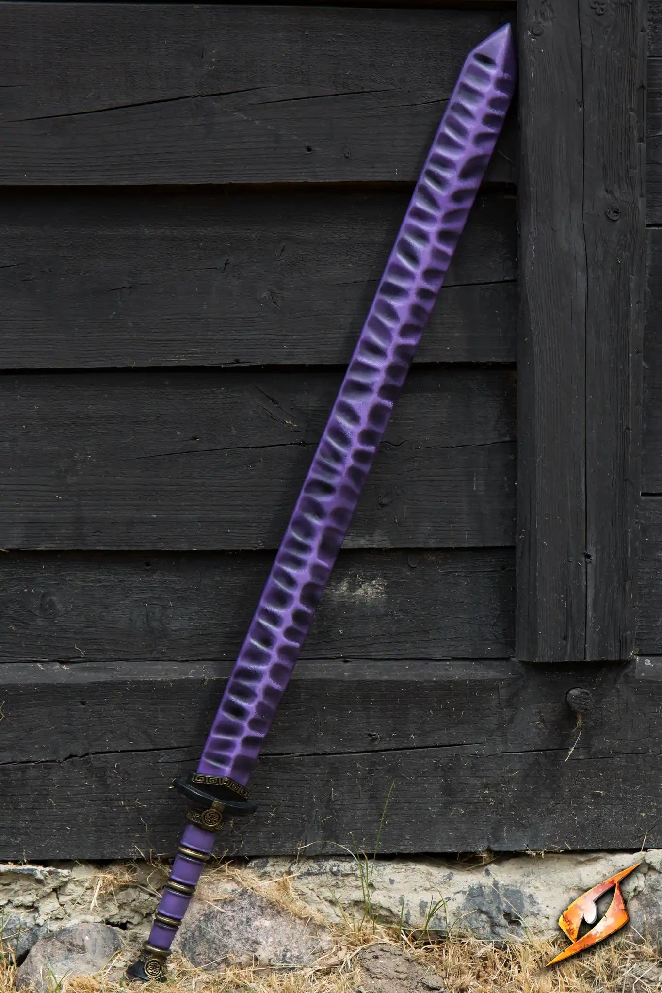 Magic Jian displayed against a rustic wooden backdrop, featuring a striking purple blade design.
