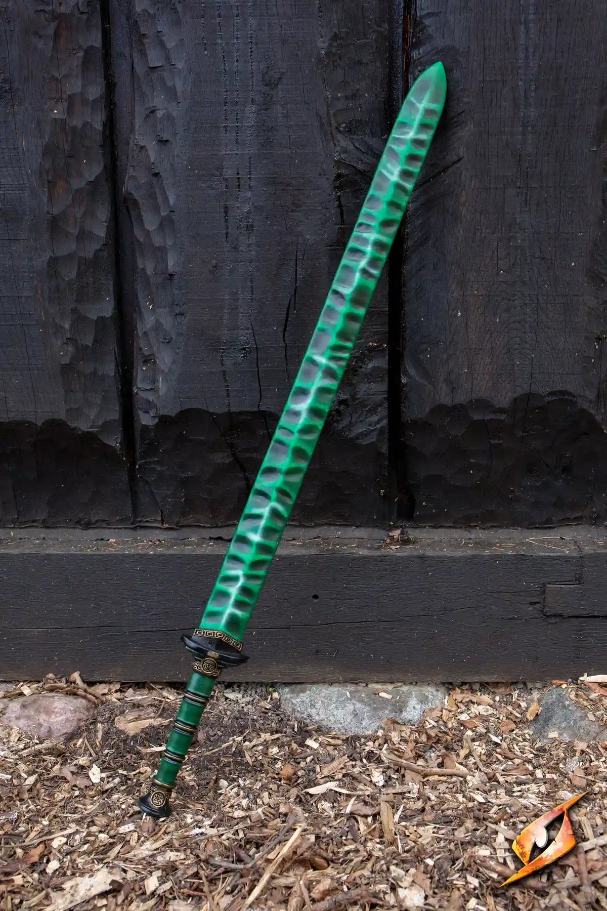 Magic Jian resting against a wooden wall, showcasing its vibrant green blade and intricate handle design.