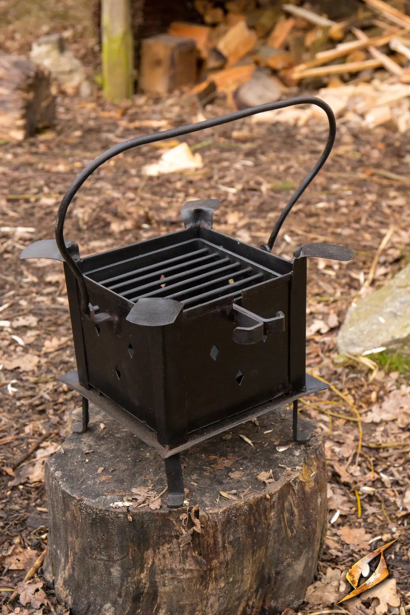 Fire Pit Roman featuring a sturdy metal design, ideal for outdoor warmth and cooking in a rustic setting.