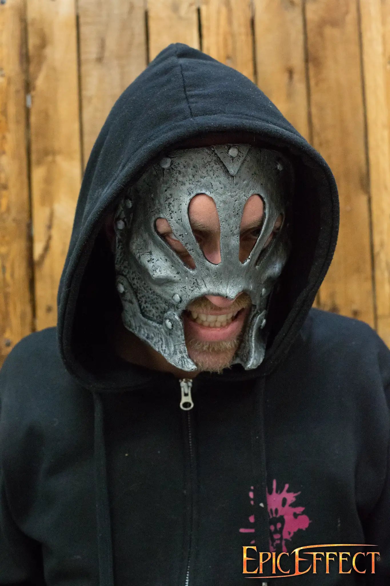 Berserker Trophy Mask worn by a person, featuring detailed sculpted rivets and a textured, metallic finish.