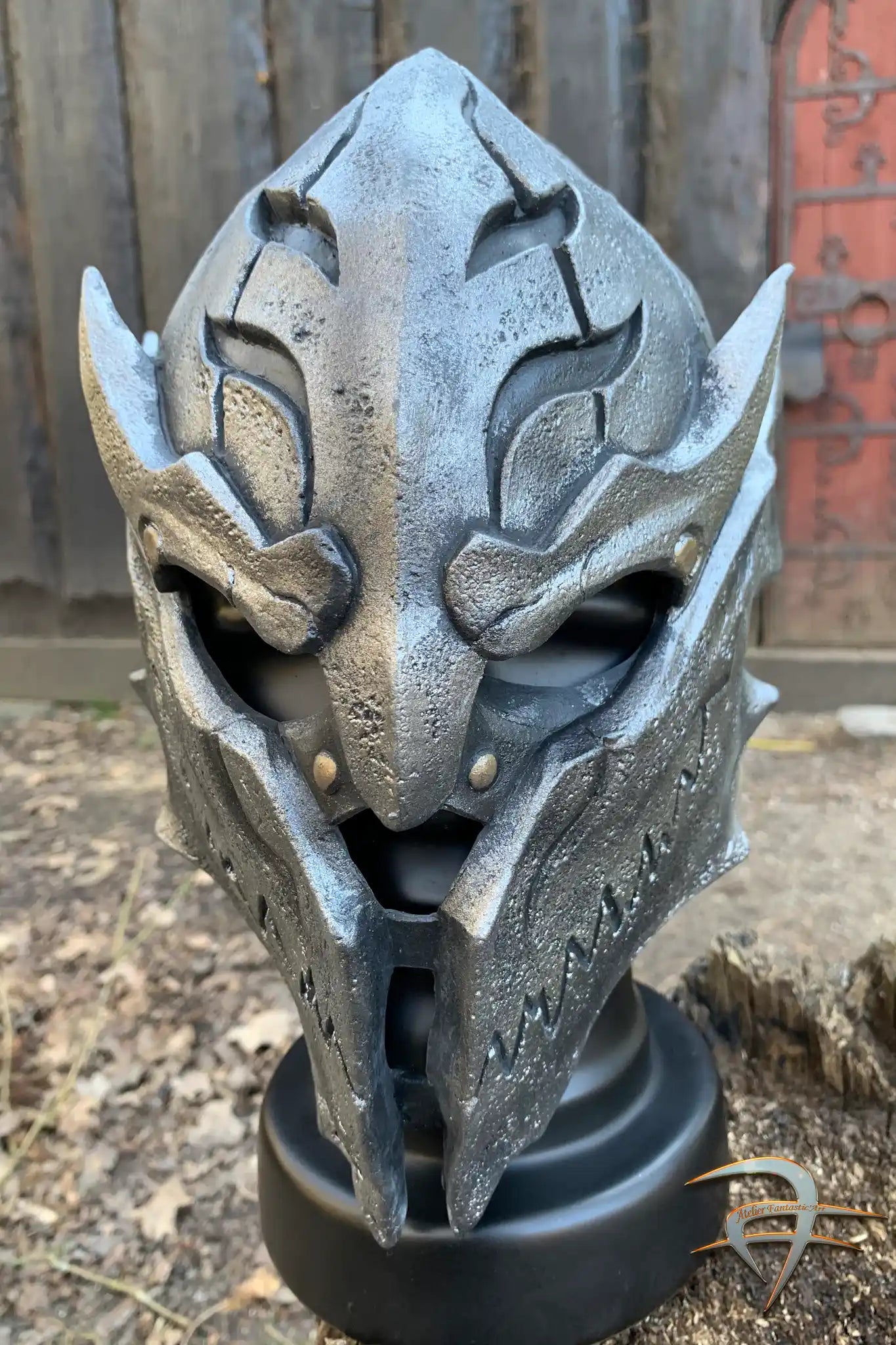 Warrior Helmet - PU detailed latex mask resembling a warrior helmet with intricate carvings and metallic finish.
