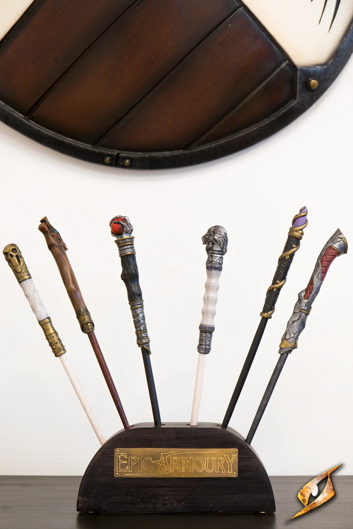 Wand Stand displaying various LARP wands on a wooden block from Epic Armoury.