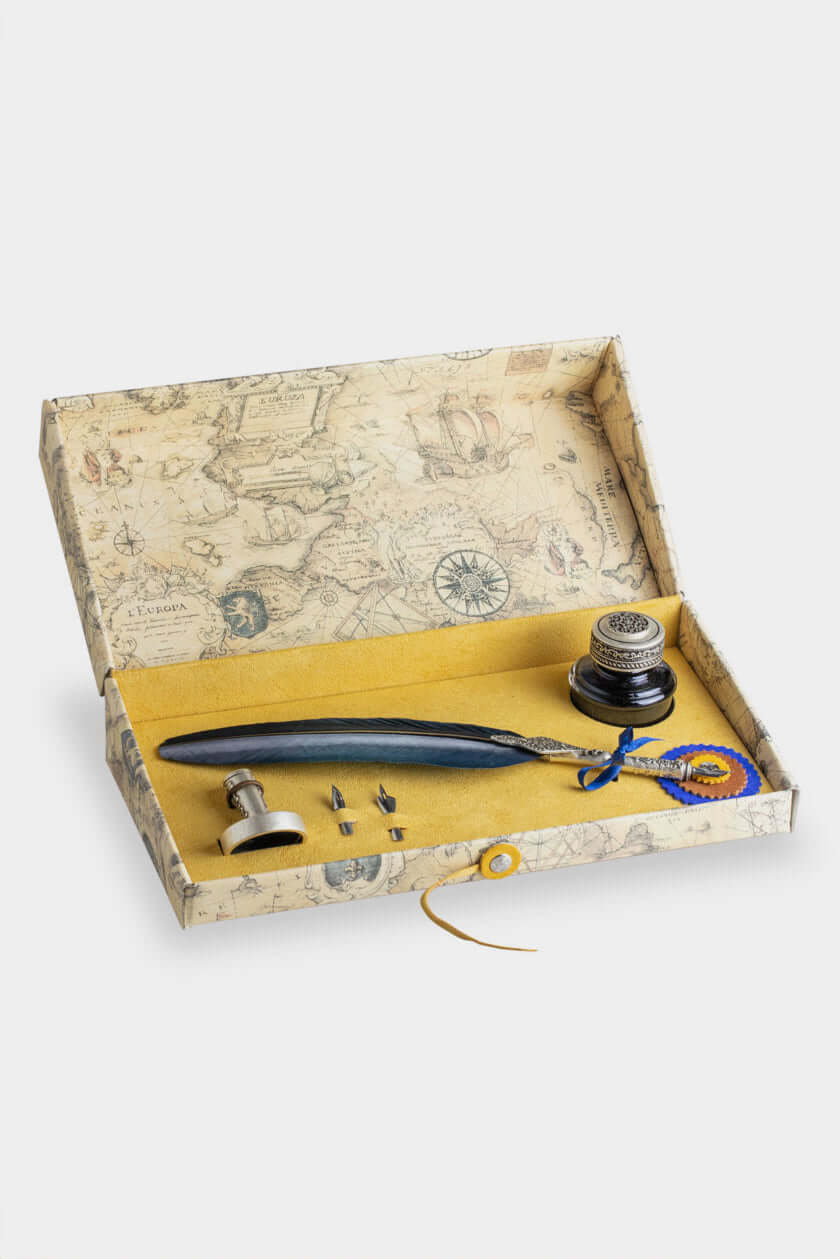 Calligraphic Writing Set featuring a feather pen, inkwell, and spare nibs in an antique-styled box.
