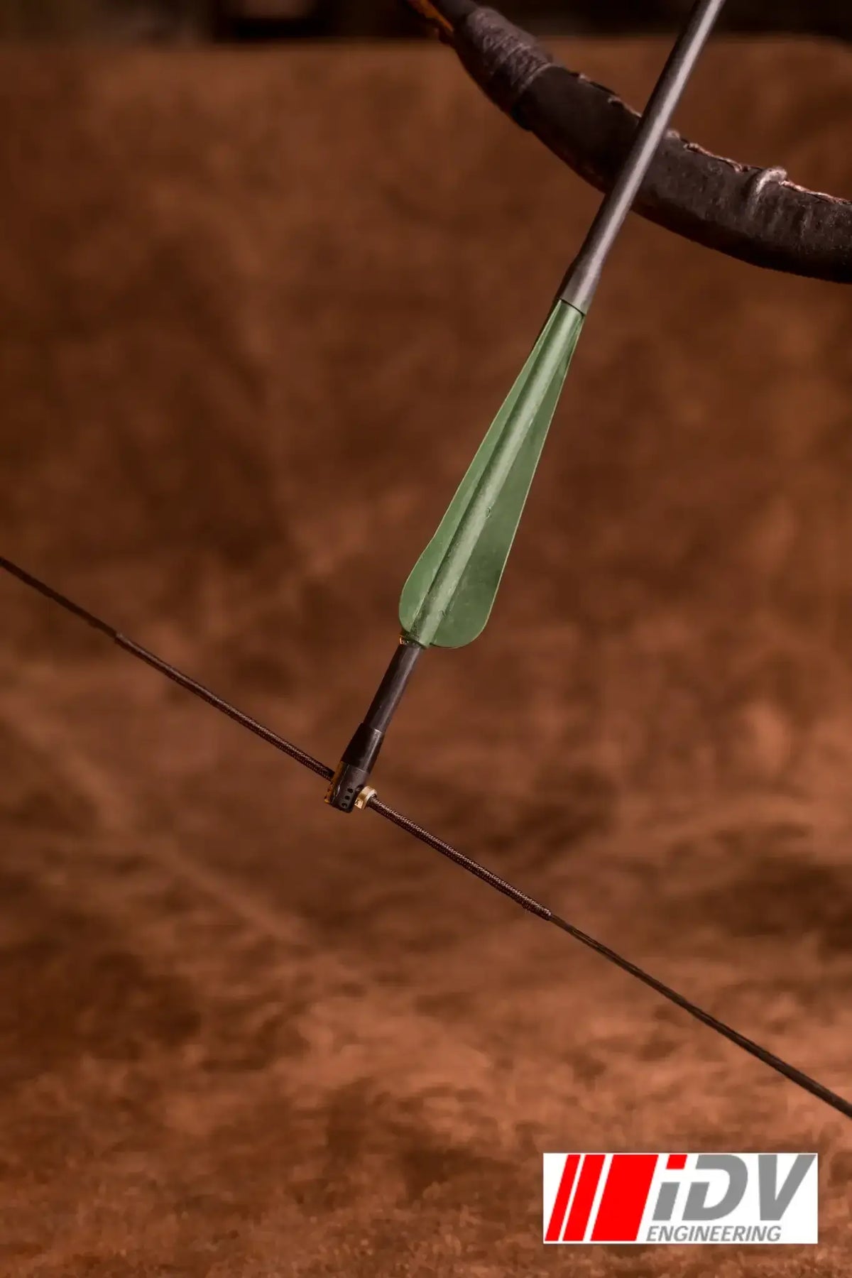 Close-up of a bowstring with a String Nock Marker attached, showcasing precision in archery equipment.