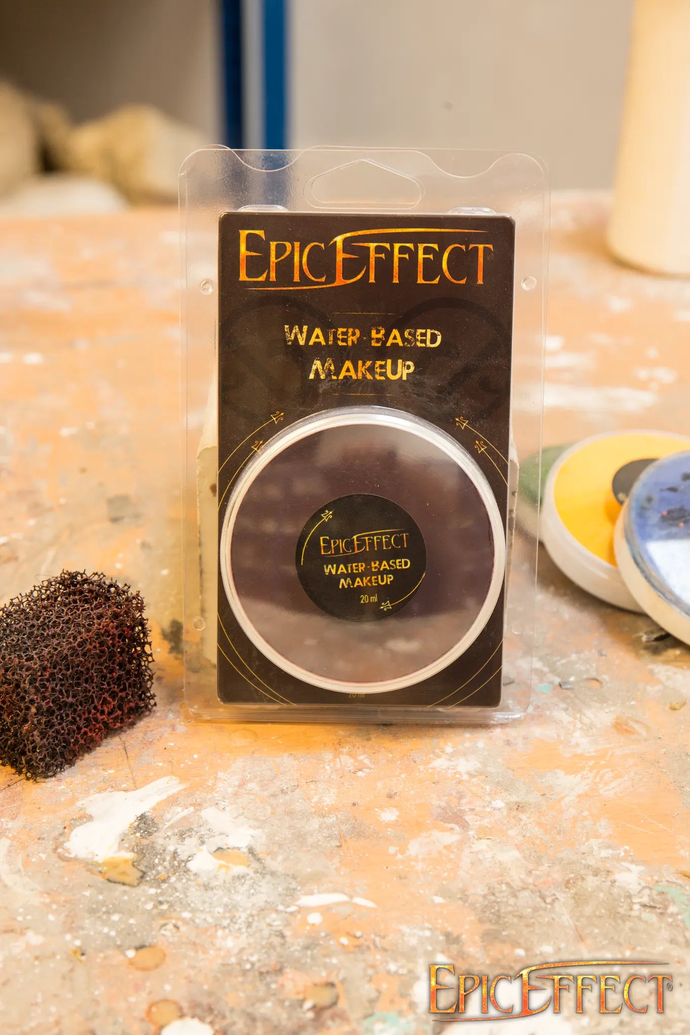 Water Based Make Up - Bordeaux by Epic Effects in a clear packaging on a work surface.