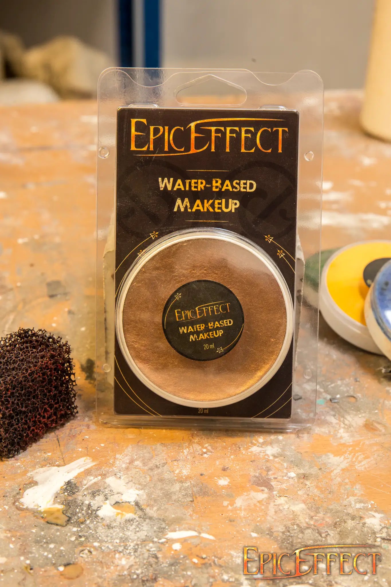 Water Based Make Up - Bronze by Epic Effects in compact packaging on a work surface.