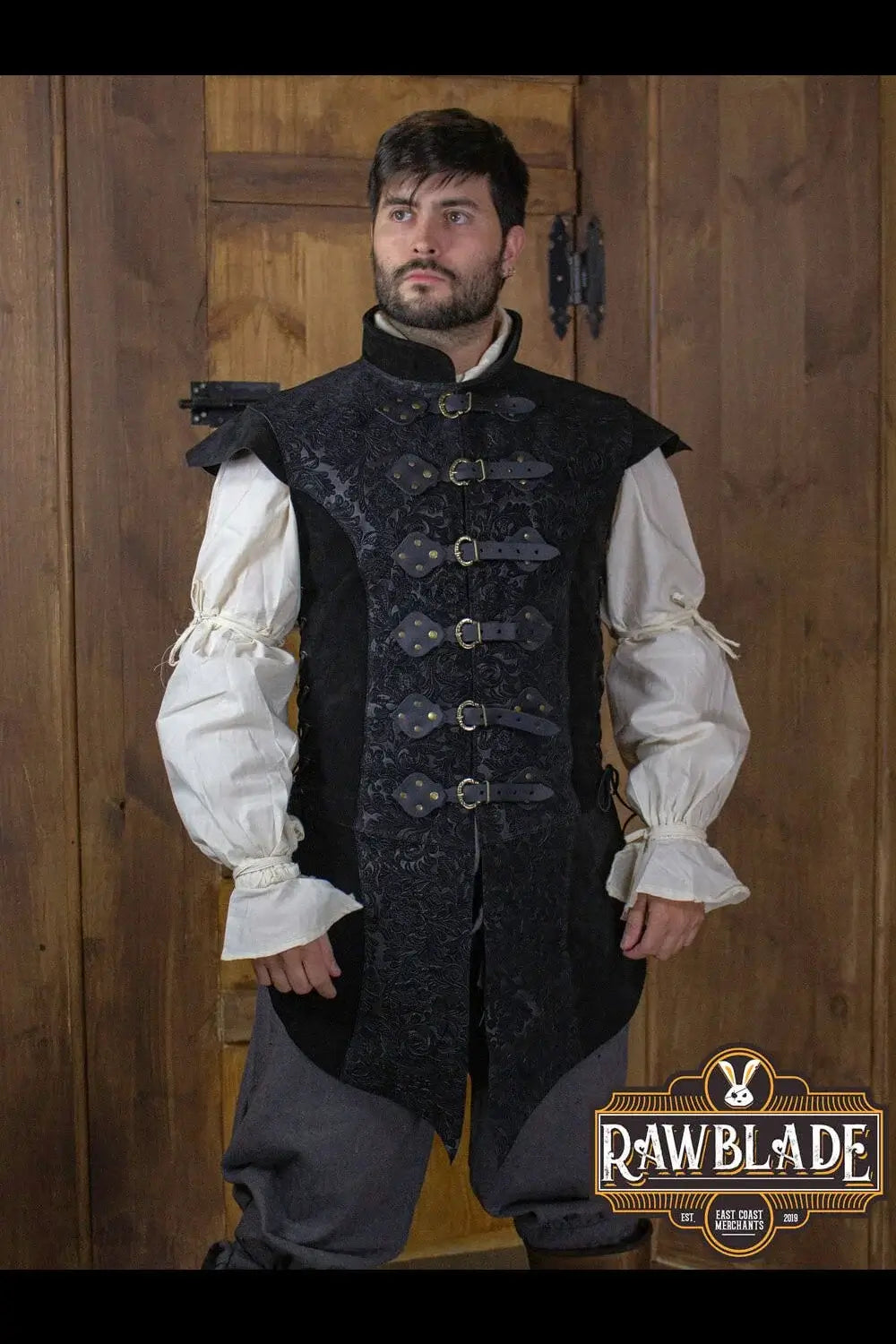 Yalon Long Jerkin Deluxe worn by a man, featuring leather accents and ornate buttons, perfect for elegant characters.