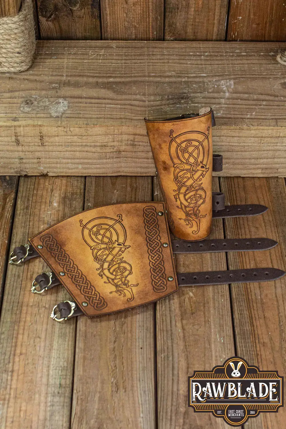 Detailed image of Wyrm Bracers made from high quality leather, featuring intricate Viking designs and adjustable leather cords.