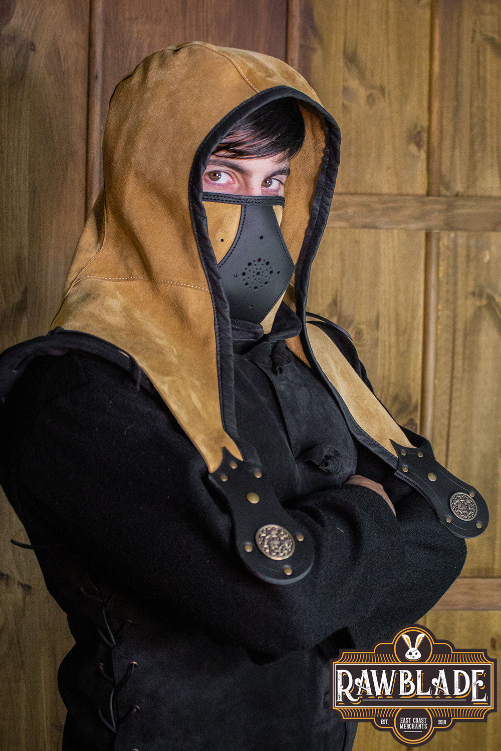 Person wearing an Akku Splitleather Hood with a mask, showcasing a unique design inspired by various characters.