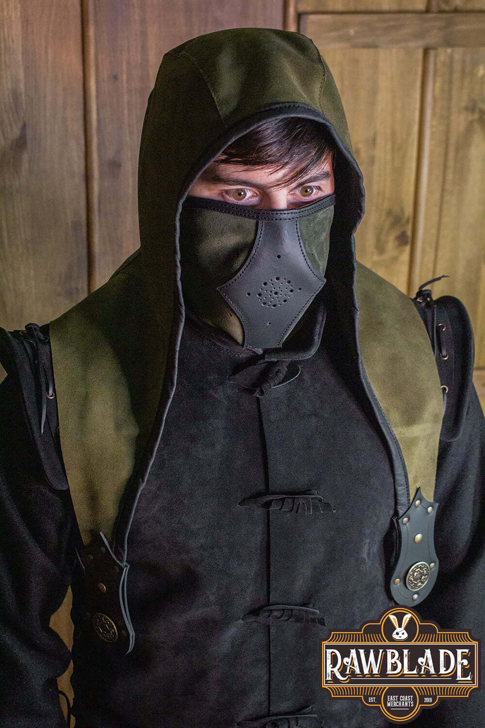Person wearing an Akku Splitleather Hood with mask and leather details, inspired by various characters.