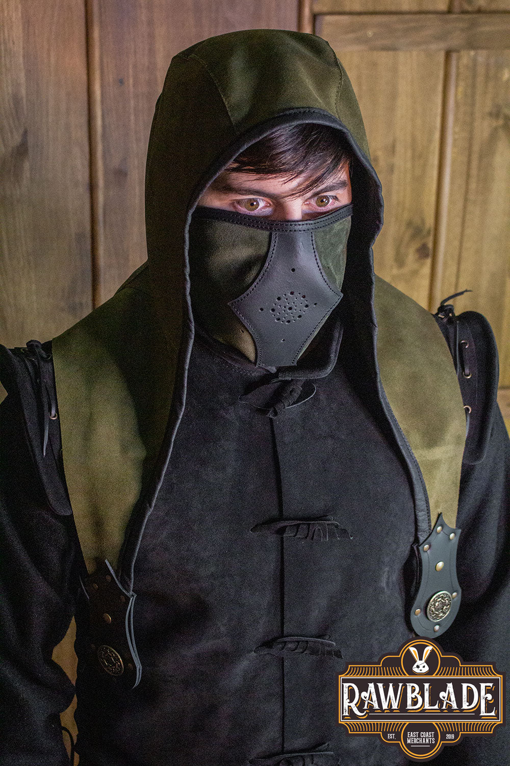 Person wearing an Akku Splitleather Hood with mask and leather details, inspired by various characters.