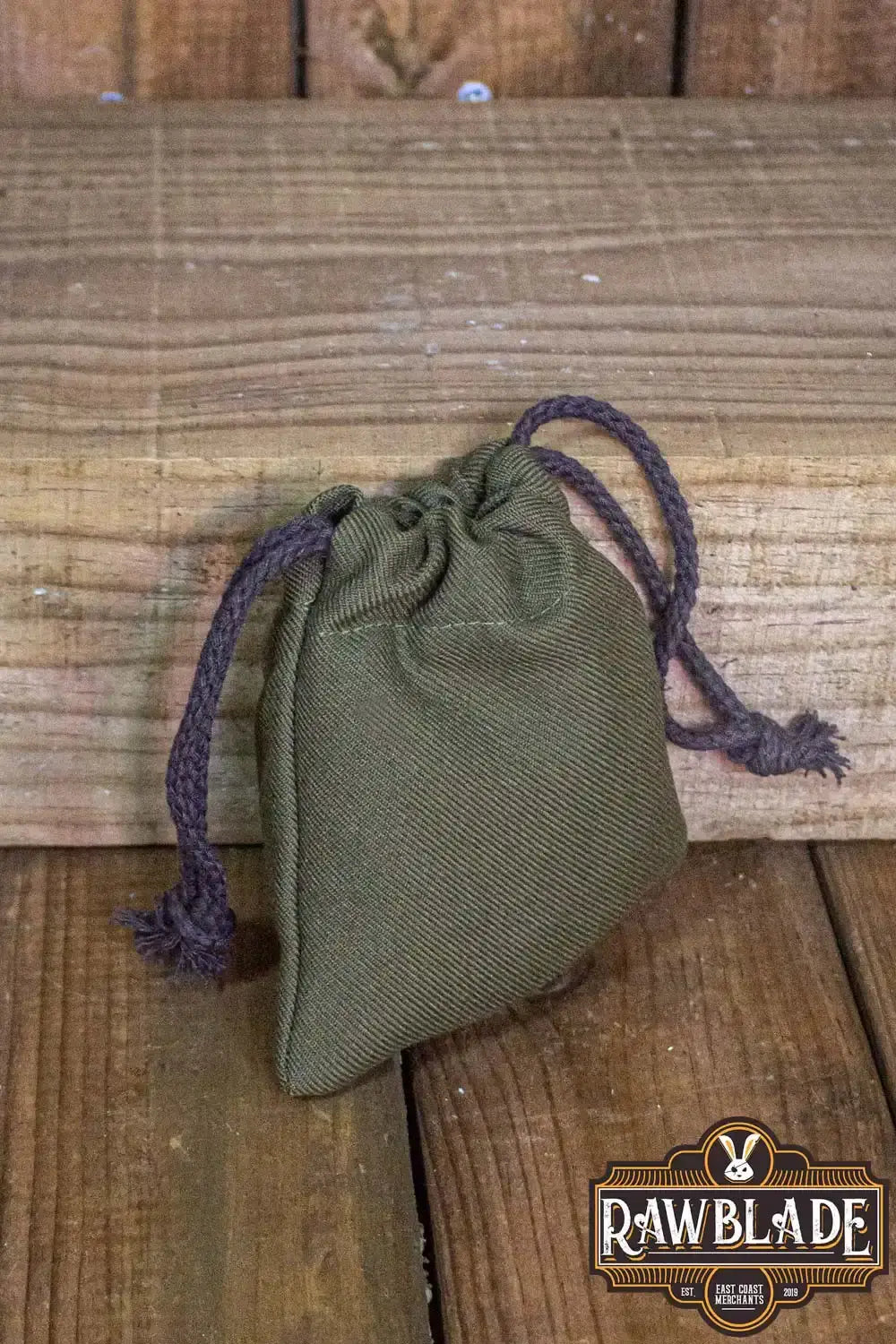 Timber Pouch Premium displayed on wooden surface, showcasing its thick cotton and panama-style fabric design.