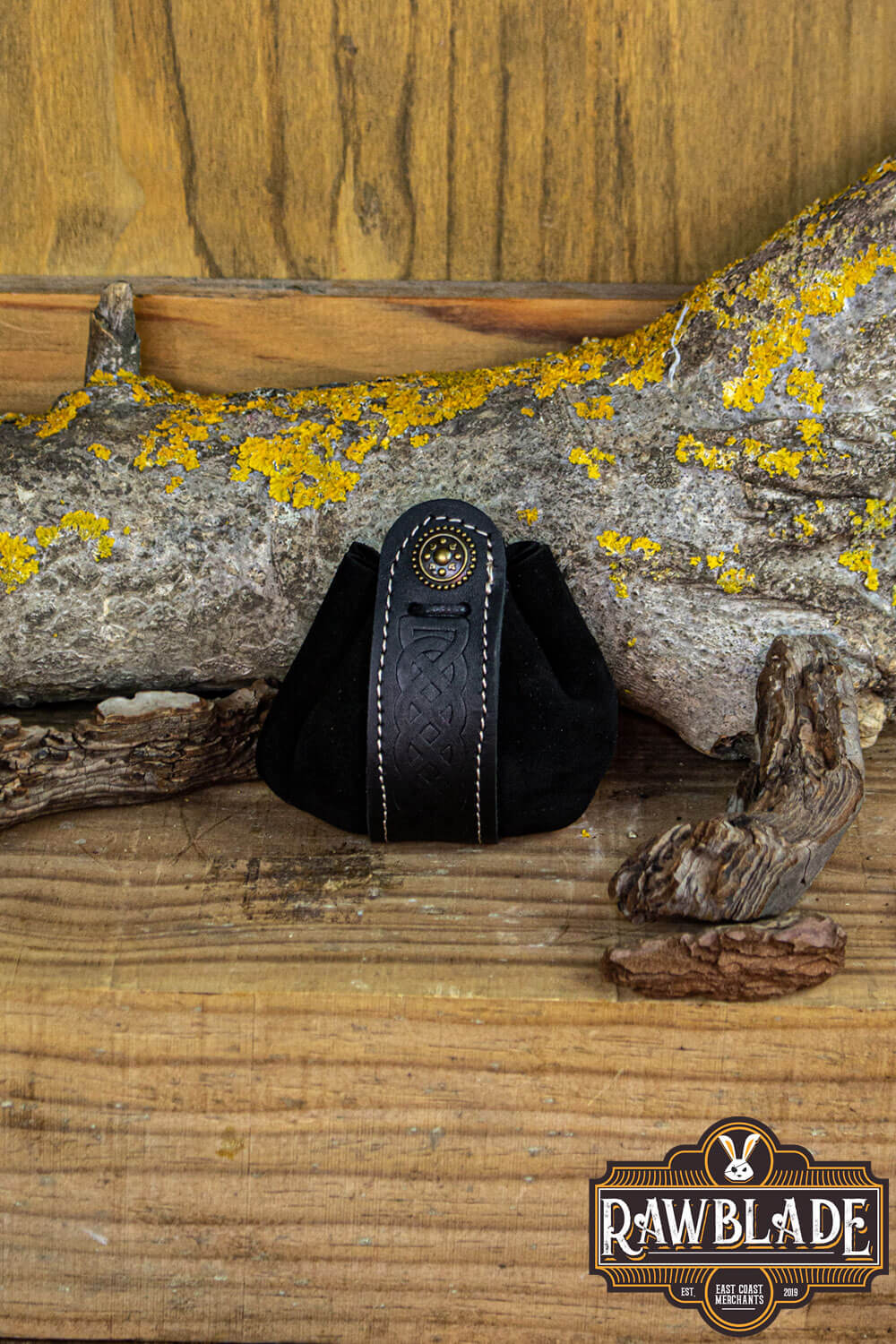 Wanderer Pouch Small black leather bag with Celtic motifs on wooden background