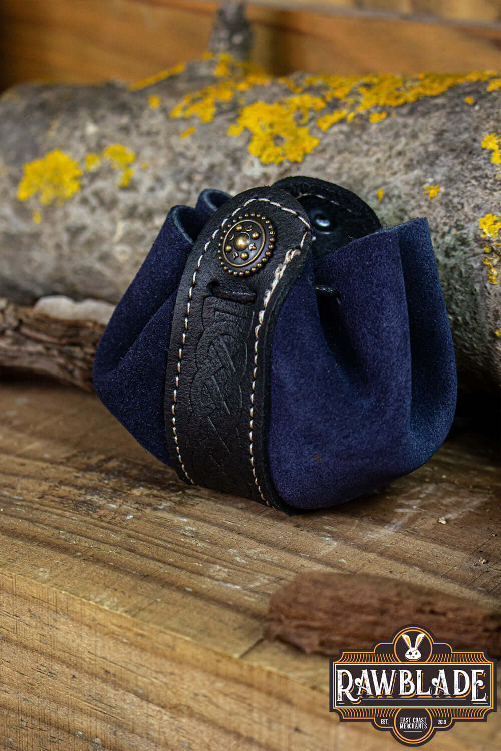 Wanderer Pouch Small in blue split-leather with Celtic motifs on wooden background.