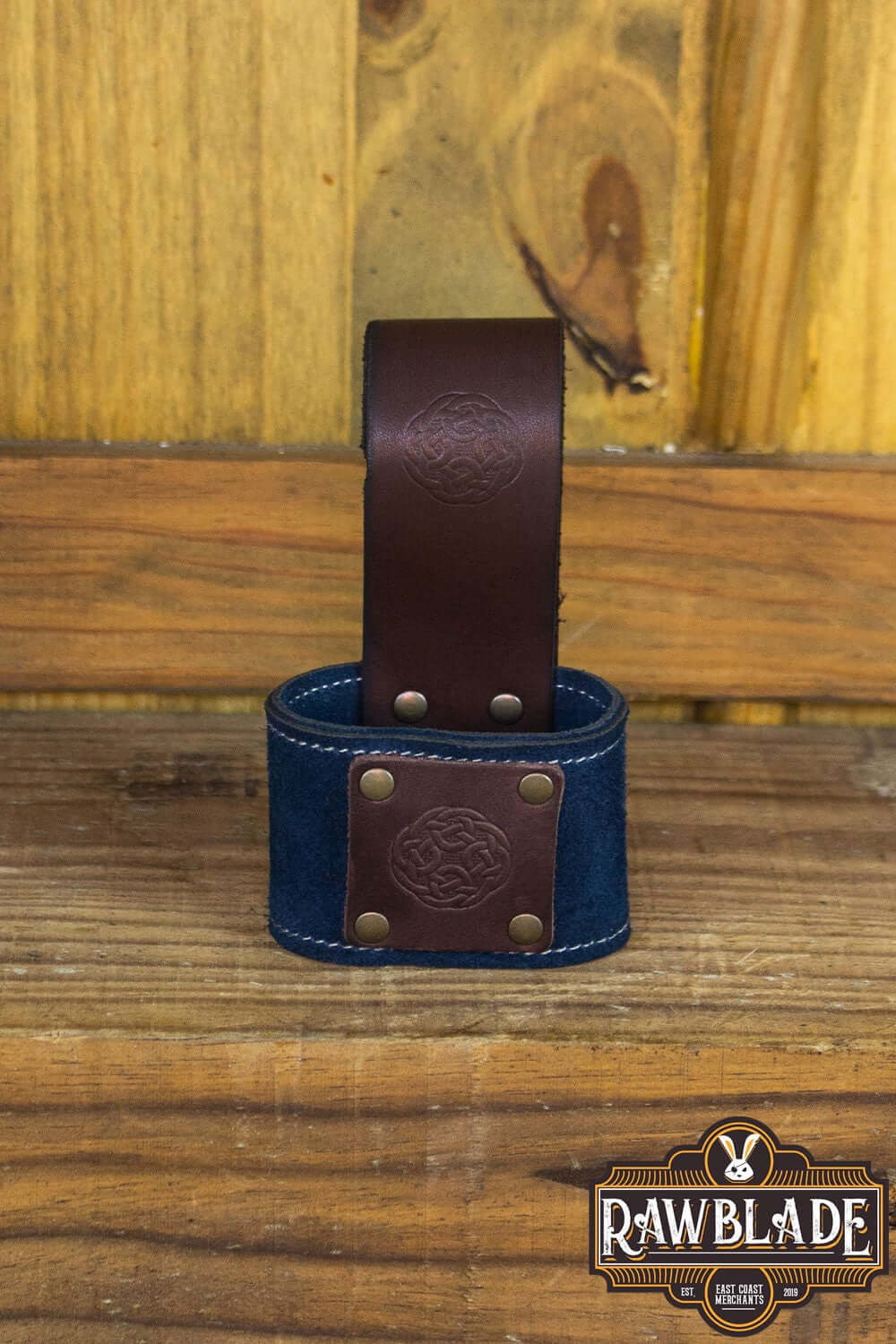 Wanderer Holder featuring engraved split leather and Celtic designs with stitched borders and old gold rivets.
