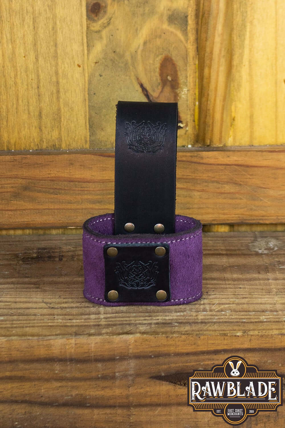 Wanderer Holder featuring engraved leather and Celtic designs, measuring 9cm wide and 5cm tall, by Rawblade.